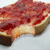 A nibbled jam toast